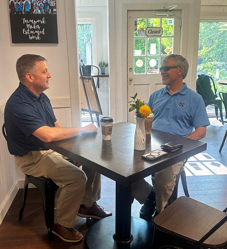 Robert Bartilucci meeting with a client at a Cary coffee shop