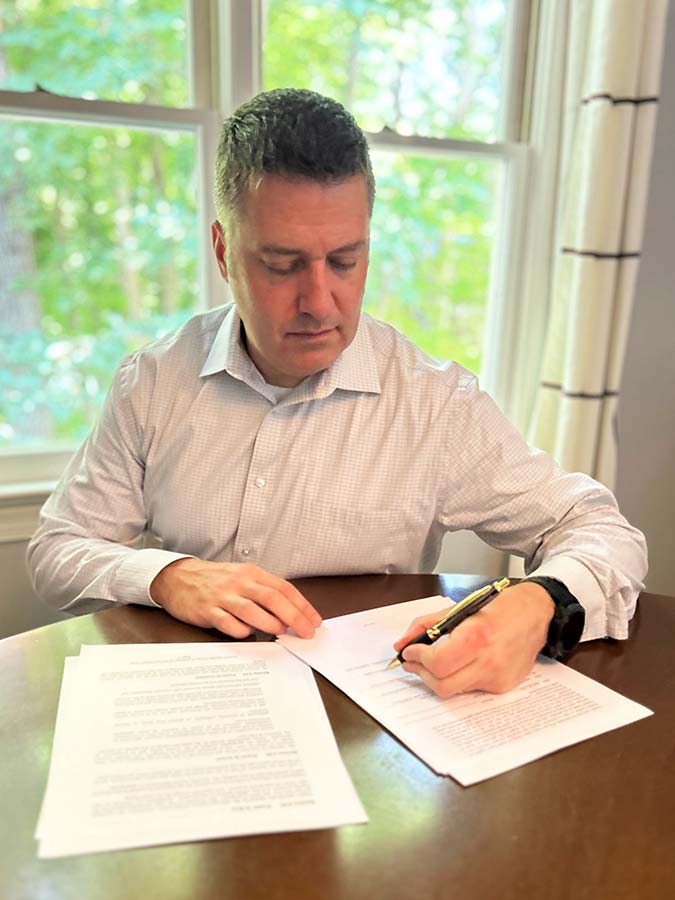 Robert Bartilucci reviewing estate planning documents