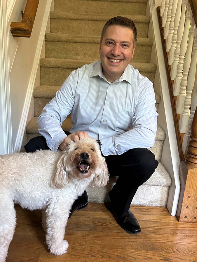 Robert Bartilucci at home with his dog