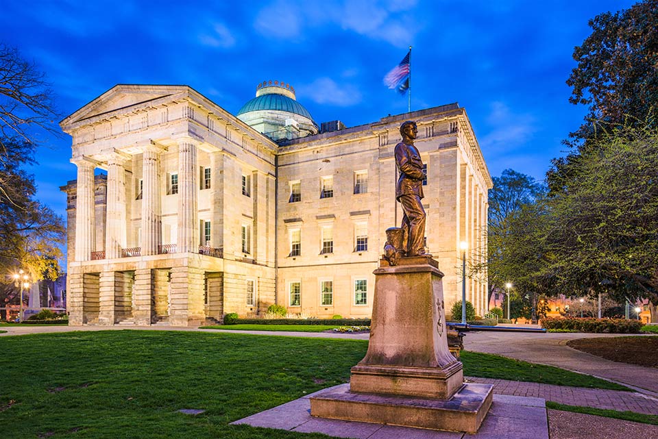 The North Carolina State Capitol building in downtown Raleigh at dusk